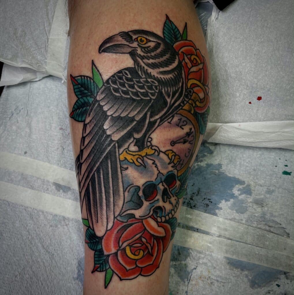 Traditional American raven tattoo with skull and pocket watch by Chris Cockrill, San Diego tattoo artist