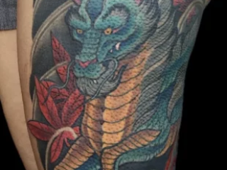 illustrative-neo-japanese-blue-teal-dragon-red-maple-leaves-thigh-tattoo-terry-ribera-san-diego